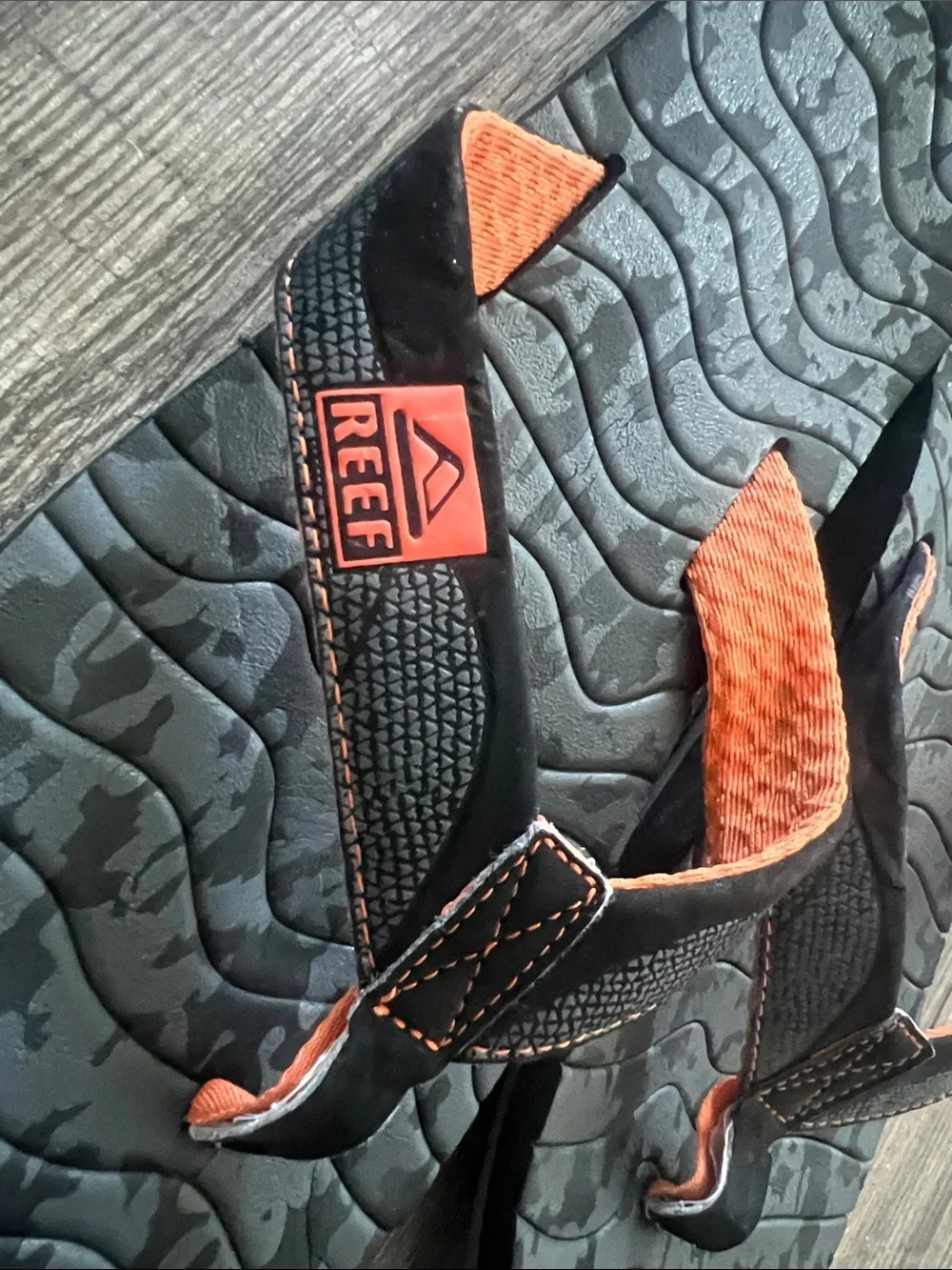 Reef Roundhouse Flip Flops in orange and black